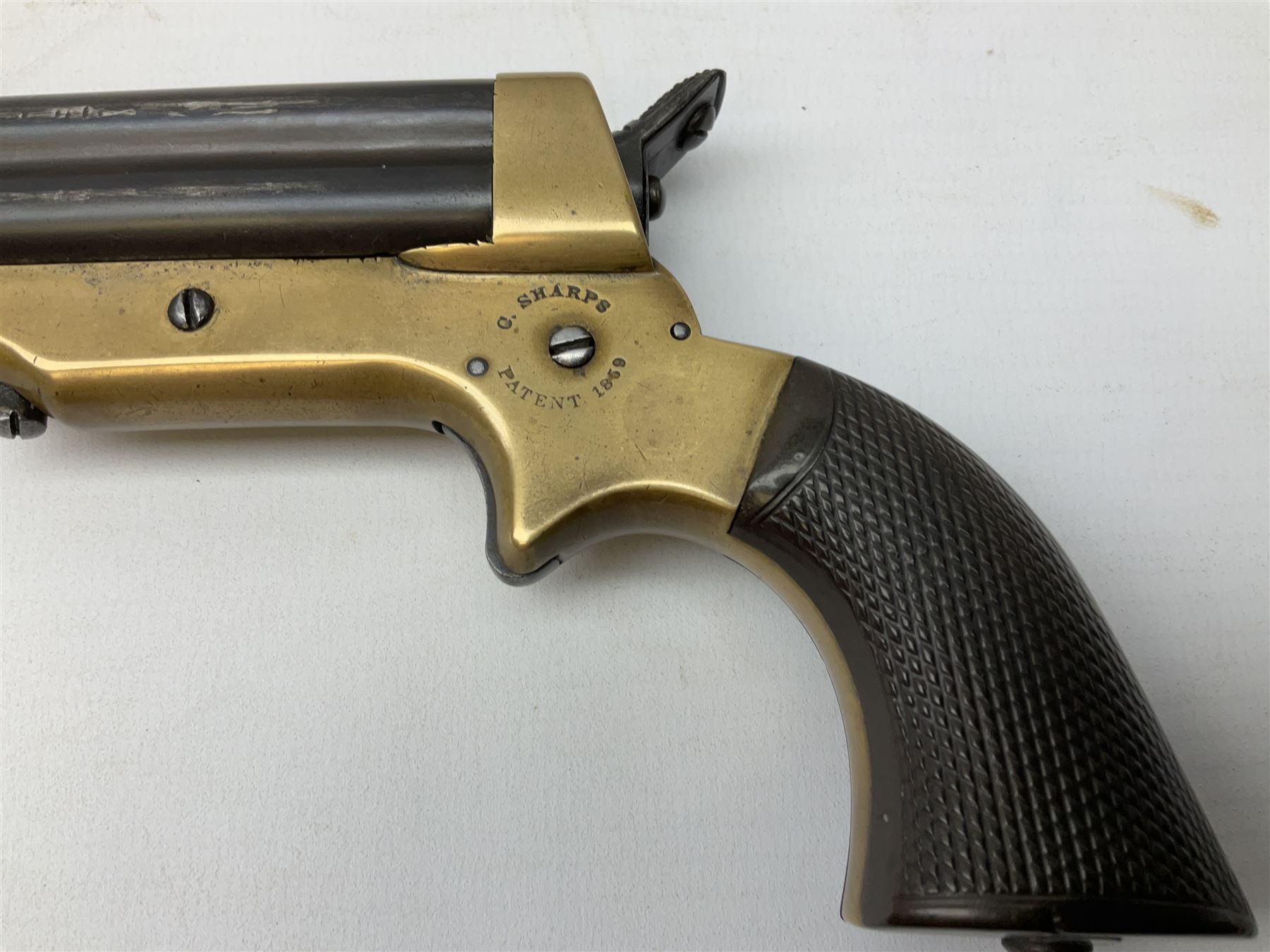 Mid-19th century Sharps' Patent Repeater four-barrelled Deringer pistol, dated 1859, approximately .30 calibre rim fire, brass bodied with rotating firing pin, serial no.8767, L16cm; in fitted rosewood box with label under lid, rack of ten deactivated cartridges, oil bottle and screwdriver and owner's name in brass cartouche to lid.