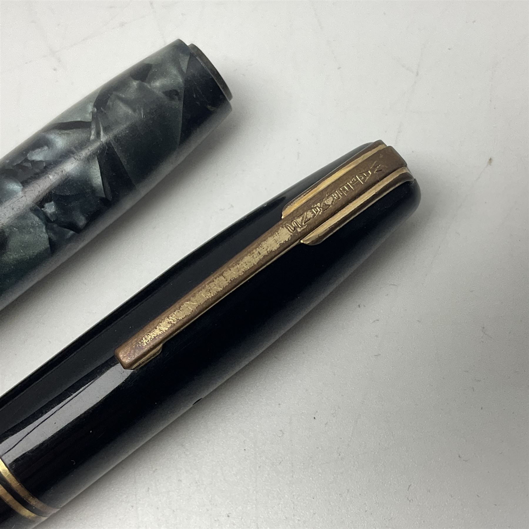 Four fountain pens, each with 14ct gold nibs, comprising Mentmore Paramount, Parker Junior Duofold, Conway Stewart marbleised pen and Waterman's, together with a 14ct gold Conway Stewart 5B nib