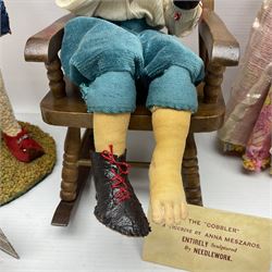 Anna Meszaros Hungary - three hand made needlework figurines - 'The Cobbler' as a child seated in a wooden rocking chair working on a removed boot H28cm; young girl in a long floral dress standing playing a harp H35cm; and young girl wearing a blue tabard standing playing a lute (3) Auctioneer's Note: Anna Meszaros came to England from her native Hungary in 1959 to marry an English businessman she met while demonstrating her art at the 1958 Brussels Exhibition. Shortly before she left for England she was awarded the title of Folk Artist Master by the Hungarian Government. Anna was a gifted painter of mainly portraits and sculptress before starting to make her figurines which are completely hand made and unique, each with a character and expression of its own. The hands, feet and face are sculptured by layering the material and pulling the features into place with needle and thread. She died in Hull in 1998.  