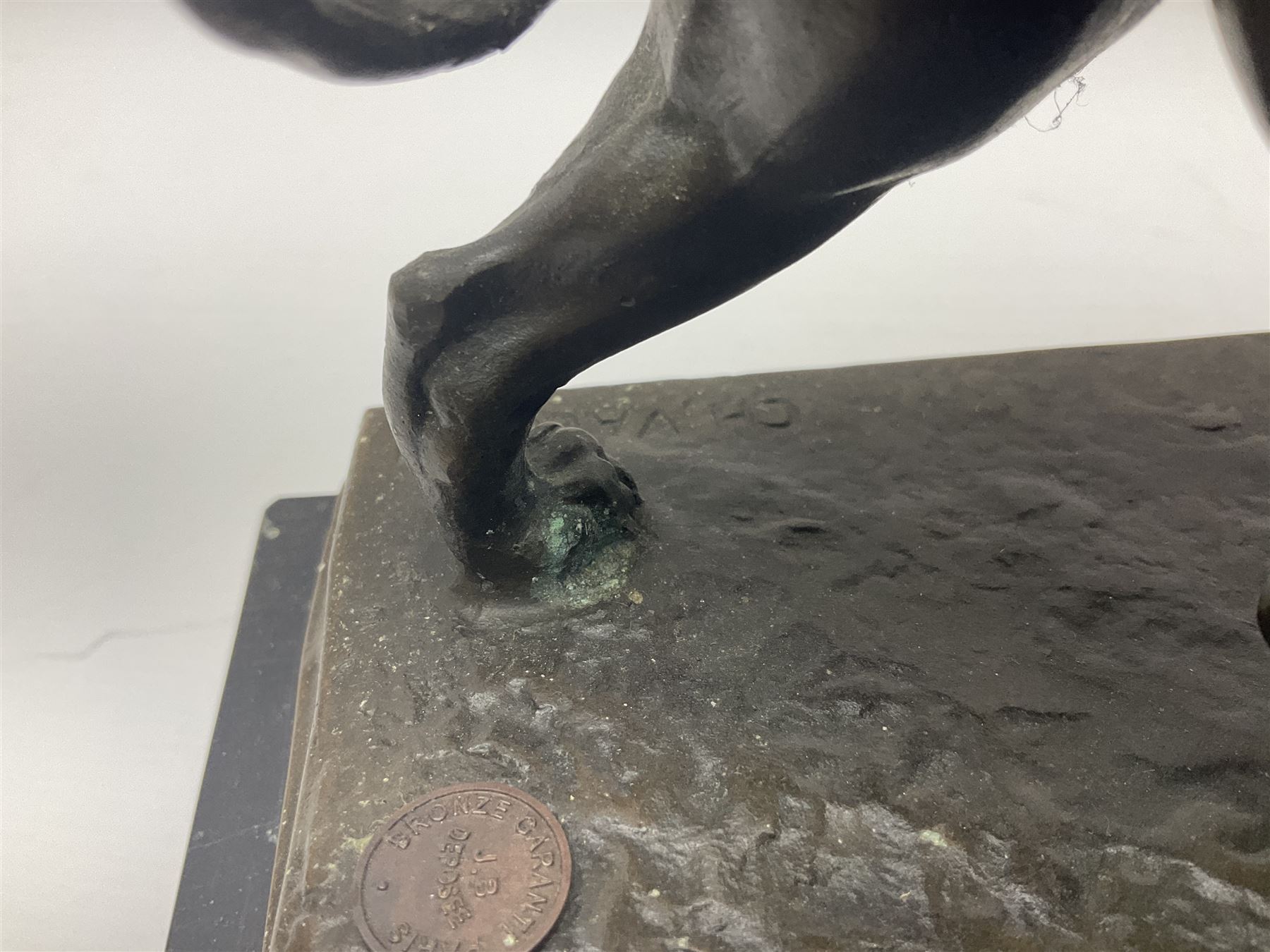 After Charles Valton, bronze, modelled as a lion, upon bronze plinth signed C H Valton, with foundry seal for J B Deposee, and black marble plinth base, overall H20cm L26cm