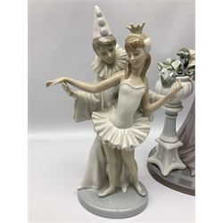 Four Lladro figures, comprising Touch of Class no 5377, Boy Student no 4517, Ocean Beauty no 5785 and Carnival Couple no 4882, largest example H45cm