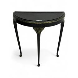Early 20th century black lacquered demi-lune side table, with gilt foliate moulded edge an...