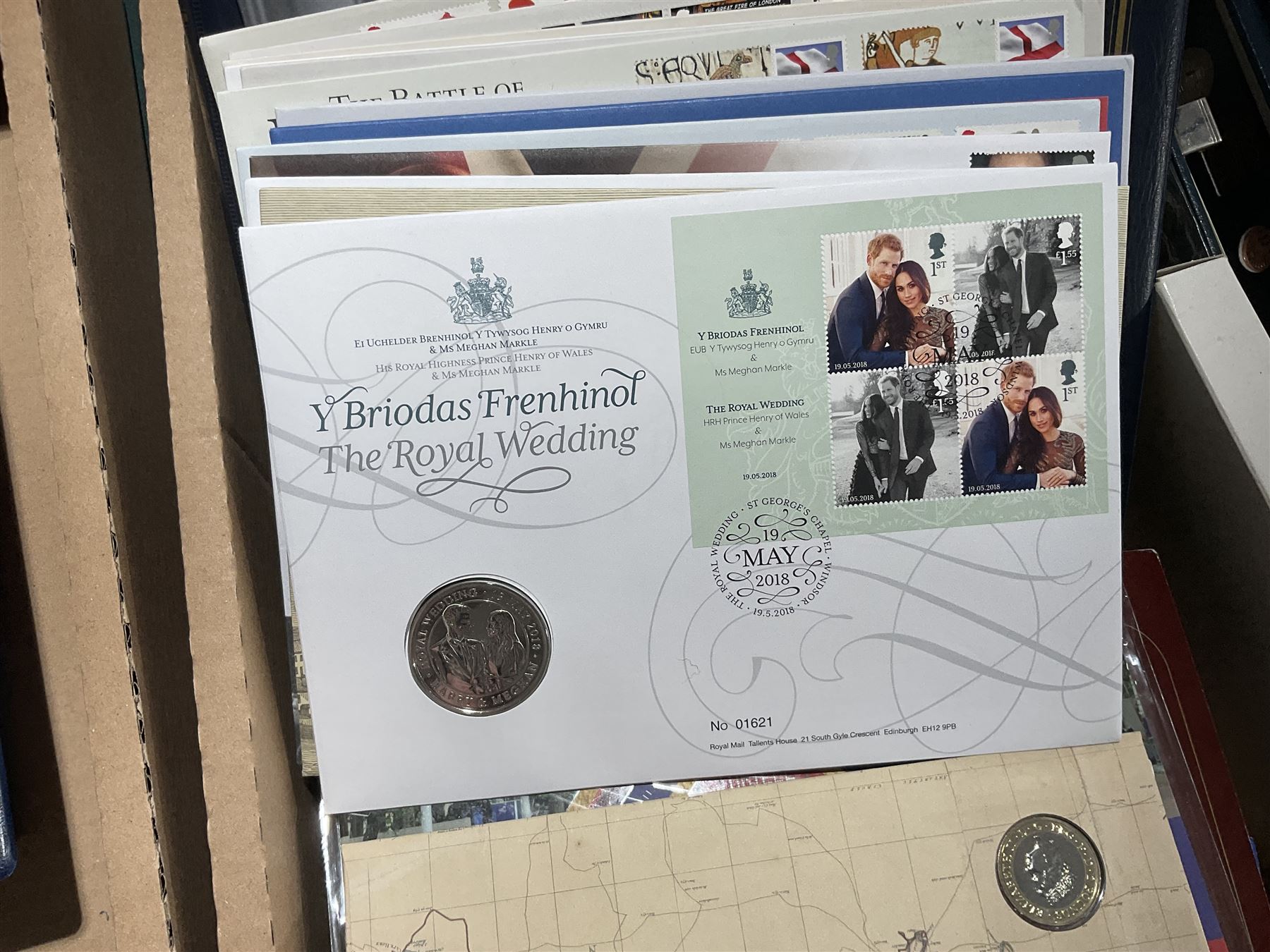 Approximately one hundred and fifteen Royal Mint coin covers, in two ring binder folders and loose, together with approximately 53 grams of Great British pre-1920 and approximately 68 grams of Great British pre-1947 silver threepence coins, and a small quantity of further pre-decimal coins