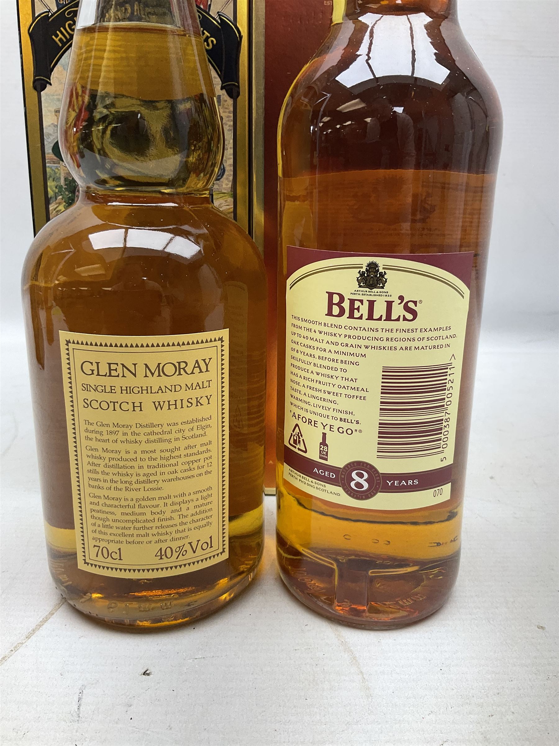 Glen Moray 12 Year Single Malt Highland Scotch Whisky, 70cl 40% vol, one bottle, in Highland Regiments The Black Watch presentation tin, Glenfiddich Pure Malt Scotch Whisky, Special Old Reserve, 70cl 40% vol, one bottle, in Clan Murray presentation tin, Bell's Extra Special Old Scotch Whisky, Aged 8 Years, 70cl 40% vol, one bottle, in box and Bell's Extra Special Old Scotch Whisky, 1l, 43% vol (4)