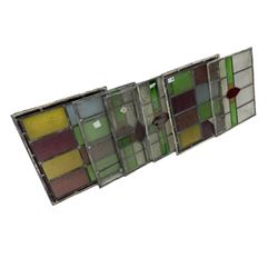 Set six leaded stained glass window panes, largest measuring 46cm x 41cm 