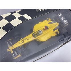 Three Minichamps 1:18 scale die-cast racing cars - Jordan Mugen Honda 198 D. Hill; Jordan Ford EJ13 G. Fisichella; and Stewart Ford SF 1 R. Barrichello; all boxed (3)