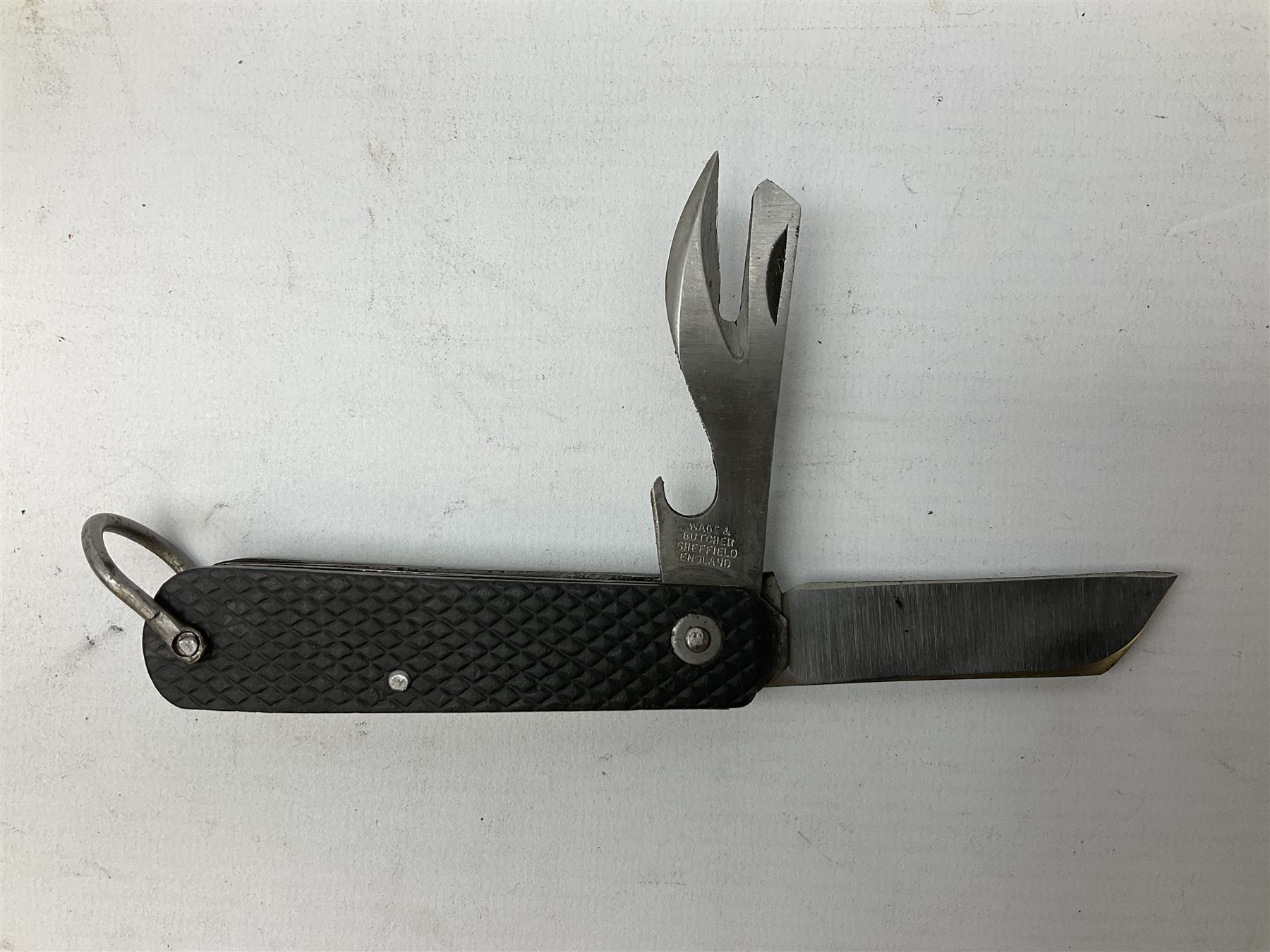 WW2 British army folding jack/clasp knife with blade and can opener marked with broad arrow and date 1944; a similar unmarked British army folding three-blade knife; and another later similar British Army knife marked Wade & Butcher Sheffield England (3)