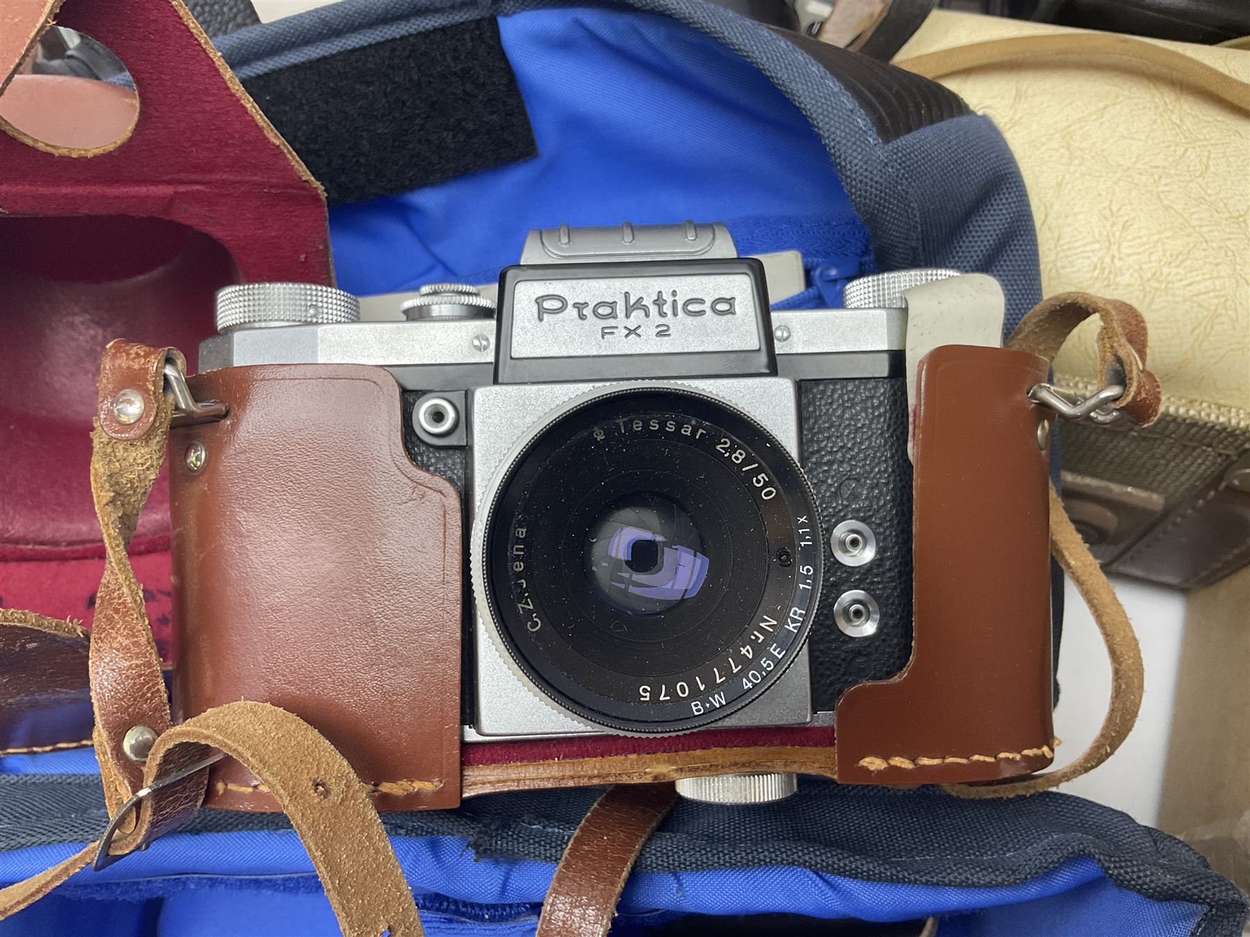 Quantity of cameras, to include Rollei 35 LED compact film camera, Praktica, Polaroid, etc