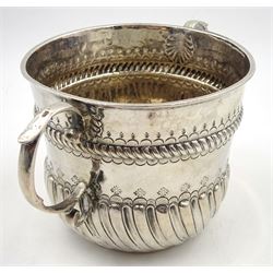 William & Mary silver porringer, the part fluted body with twin scroll handles, and chased and embossed gadrooned borders, inscribed beneath 'Rev. W. H Bps, Hull Michmas 1805', hallmarked London 1697, makers mark LO, H9cm, approximate weight 6.26 ozt (194.9 grams)

