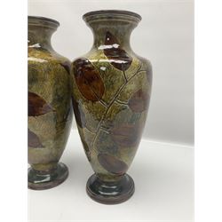 Pair of Royal Doulton Stoneware Vases with leaf decoration, by Ethel Beard, impressed marks to base numbered 6768 and 8222 and initials EB, H32cm