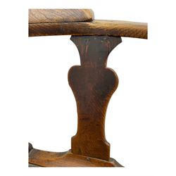 18th century oak corner elbow chair, the shaped cresting rail terminating to swept arm rests, supported by turned columns and vase-shaped splats, over square plank seat, raised on square-section supports