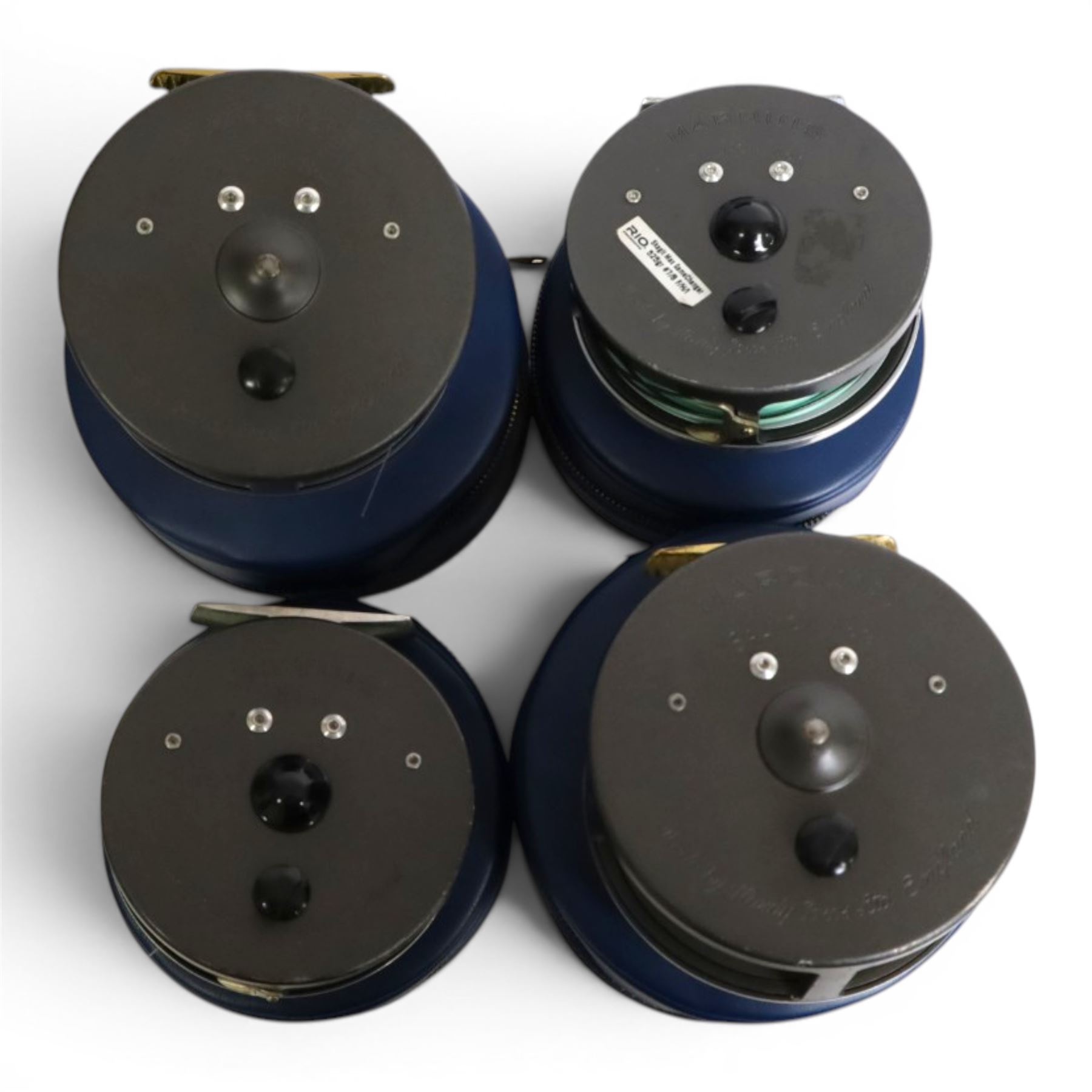 Four Hardy Bros Marquis fly fishing reels, comprising two No. 3 salmon reels, No.1 Salmon reel and a No. 10 reel, all within blue Hardy cases