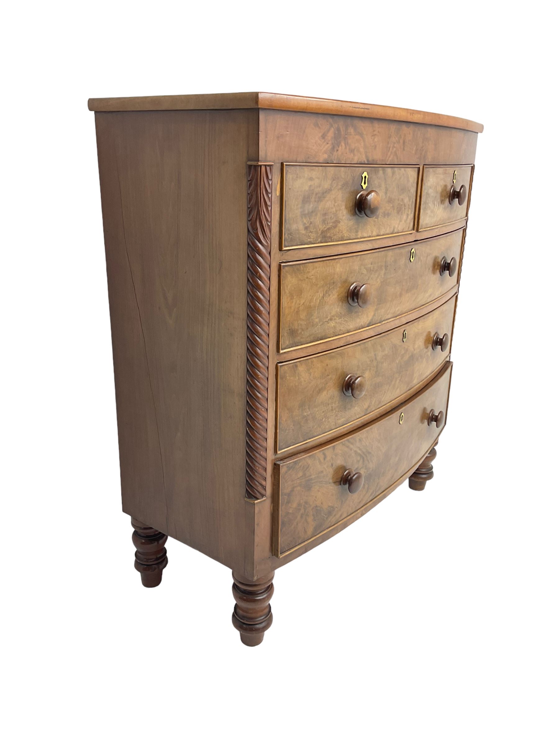 Late 19th century mahogany bow-front chest, fitted with two short drawers over three long drawers each with cockbeaded fronts, raised on turned feet