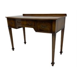 Georgian style mahogany bow front writing table, fitted with three drawers, square tapering moulded supports with spade feet