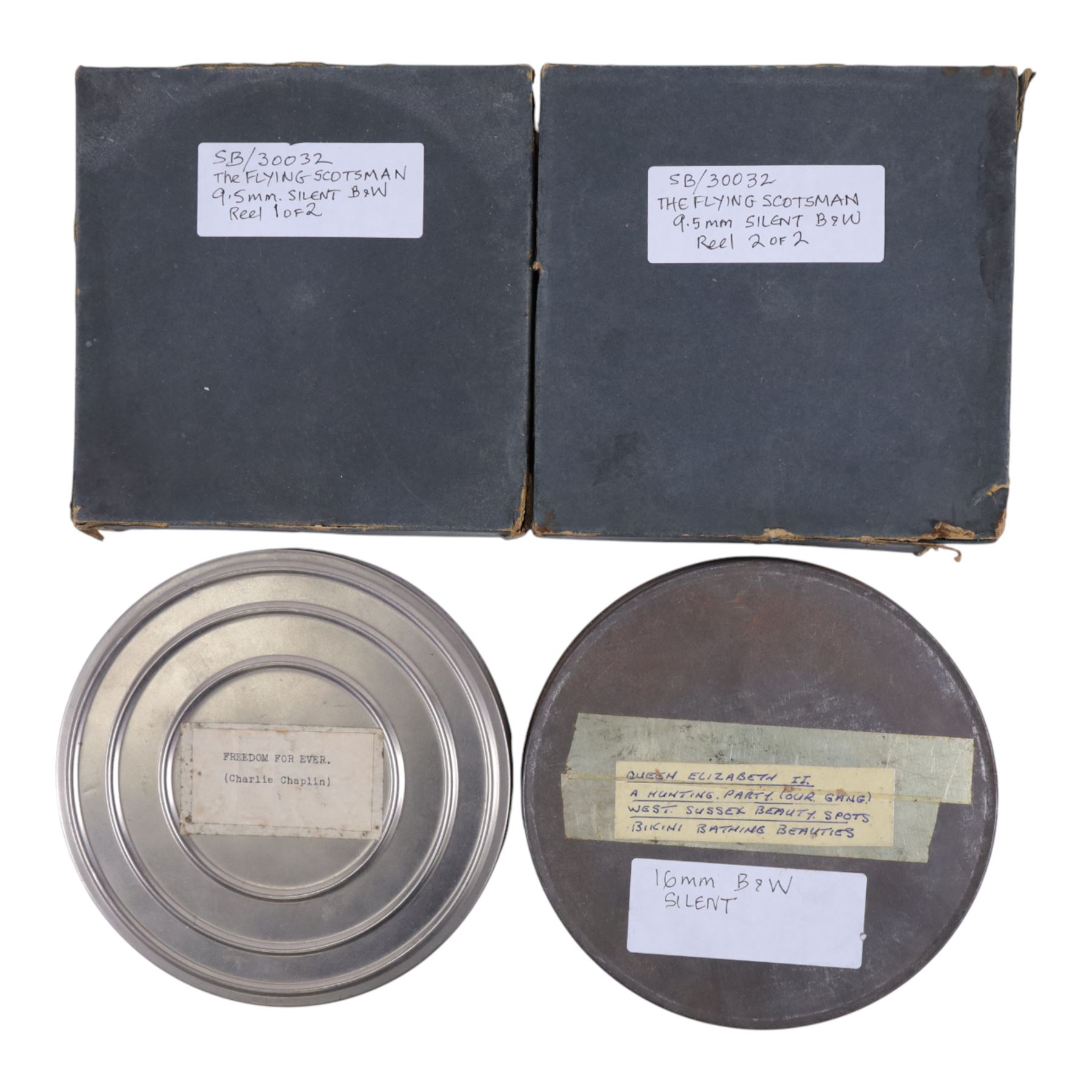 Collection of 9.5mm and 16mm cine film reels, mostly silent black and white with some notched examples, including 'Freedom Forever' Charlie Chaplin, 'The Flying Scotsman' on two reels, 'Passenger Locomotives Past and Present', 'Harvest Hands', 'What's For Dinner', Mickey Mouse and Popeye shorts, 'Queen Elizabeth II Hunting Party, etc, most in tin cases with hand written titles