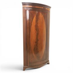 Edwardian inlaid mahogany cylindrical corner hall-robe, projecting cornice, figured veneer...