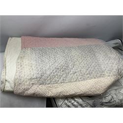 Large quantity of various linen and fabrics to include patterned quilted bedspread, etc
