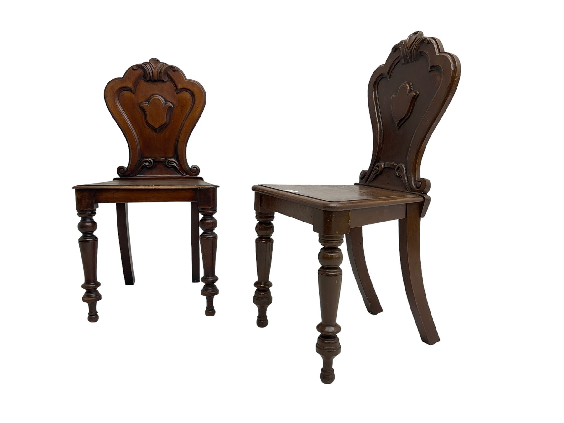 Pair of Victorian mahogany hall chairs, shaped moulded back carved with cartouche, moulded seat on turned front supports