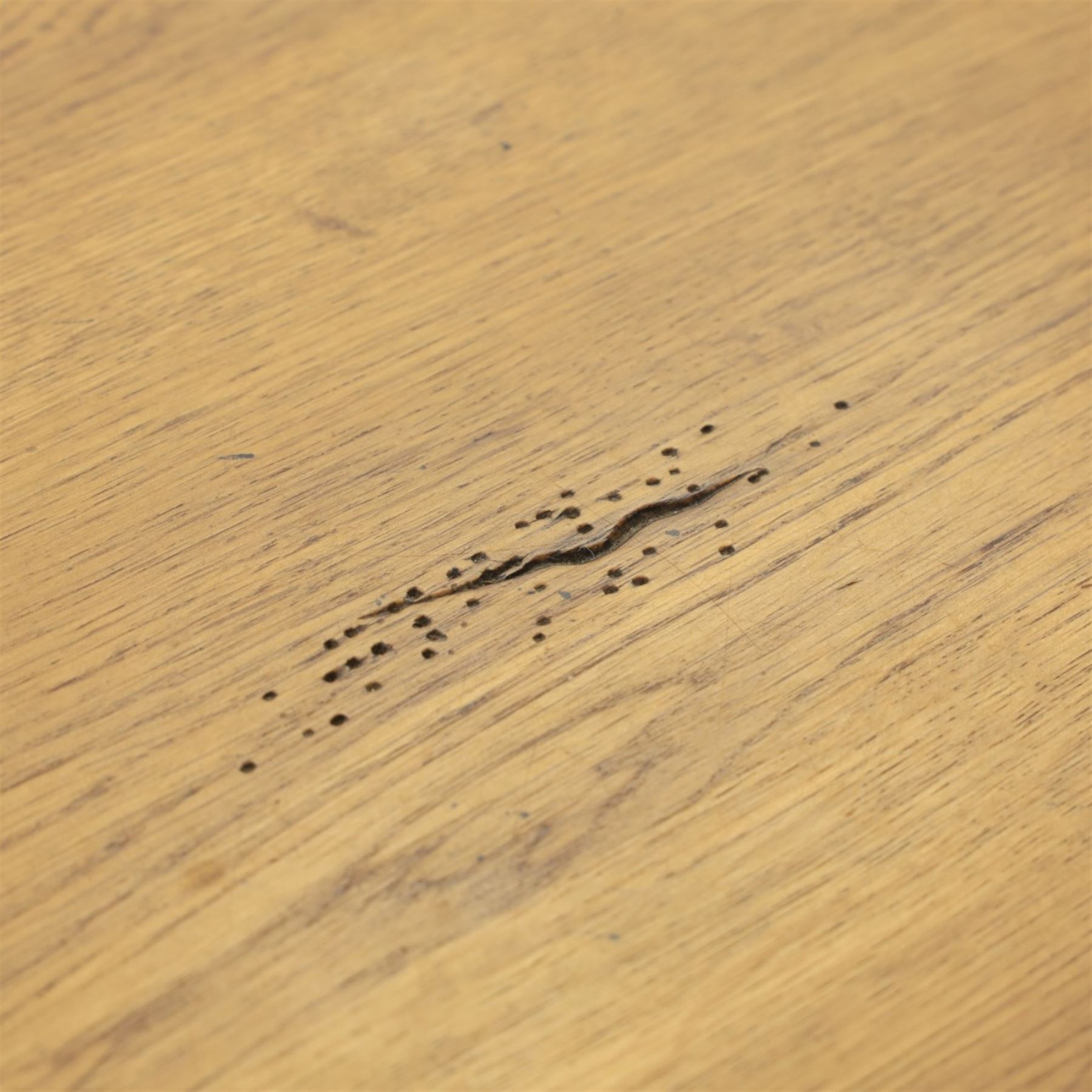 Traditional oak refectory dining table, fitted with draw leaves to either end extending to 257cm, on twin turned and block supports united by a stretcher, terminating in shaped trestle feet