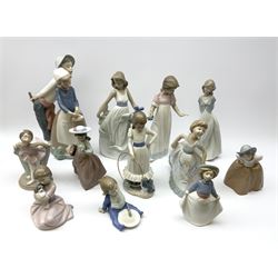 A group of assorted Nao figures, to include examples modelled as girl with chamber stick, girl with hoop and puppy, ballerina, figure group with girl and basket and boy, etc.
