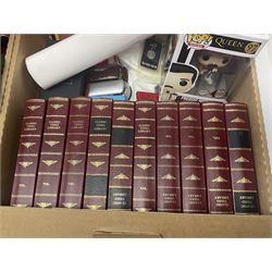 Mostly Queen and Freddie Mercury interest items, including pin badges, newspaper cuttings, diecast 'promotional' vehicles, special edition Pop Rocks figure of Freddie Mercury, VHS tapes, two charity certificates signed by Brian May and Roger Taylor, poster etc, in two boxes 