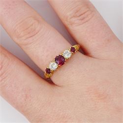 Early 20th century 18ct gold ruby and diamond five stone ring, three oval and round cut rubies, spaced by two old cut diamonds, stamped 18, total ruby weight approx 0.55 carat, total diamond weight approx 0.30 carat
