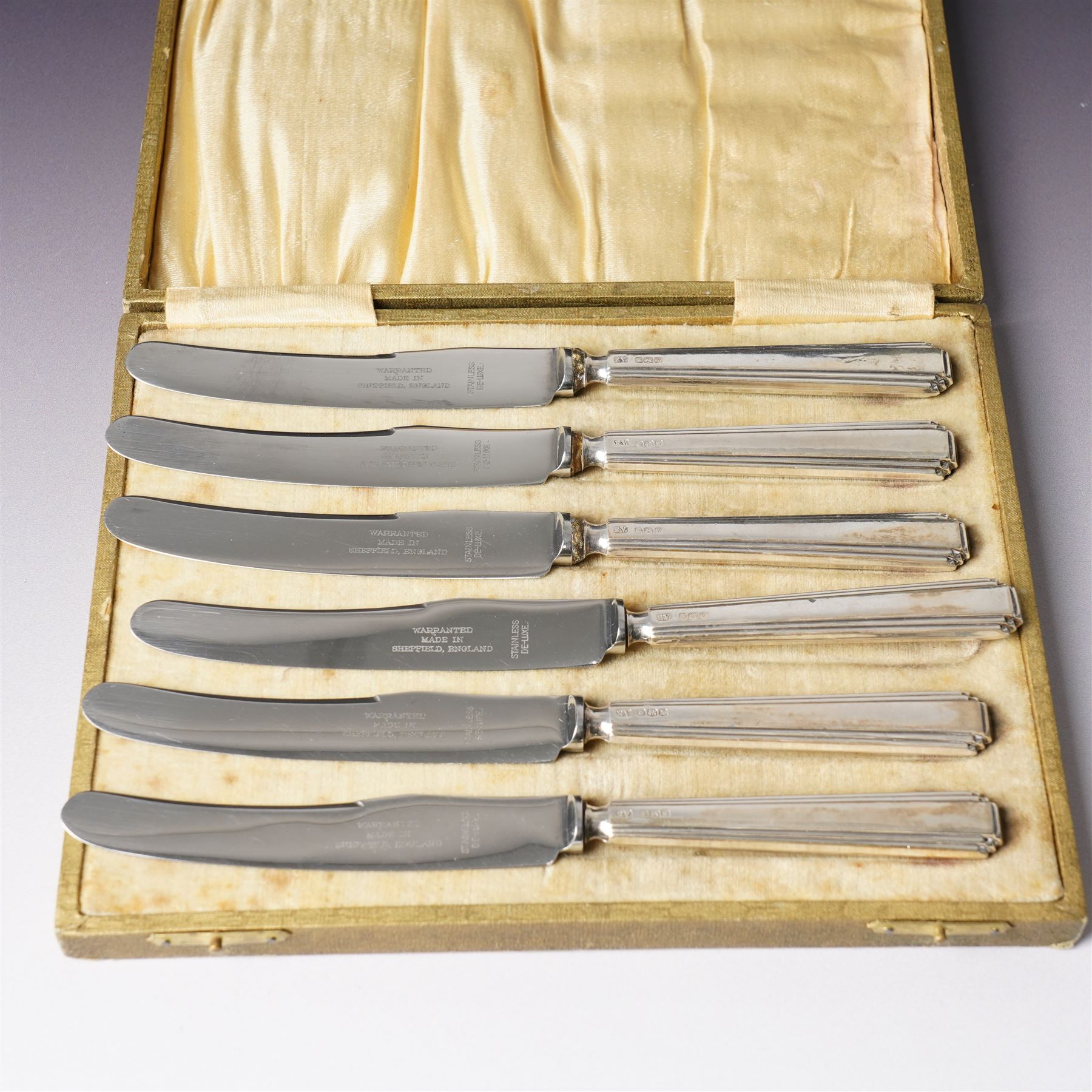 Cased set of twelve silver coffee spoons with bead knop terminals Birmingham 1910 Maker S W Smith & Co and two cases, each containing six silver handled pastry knives