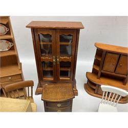 Doll's house wooden furniture - over twenty items including good quality pine Welsh dresser by Tony of Lincoln; tall 'glazed' bookcase; two-tier side cabinet; grand piano; bedside chest, mule chest, Canterbury; cradle; Georgian style hanging corner cupboard; dumb waiter; tables; chairs; rocking chair etc; various scales