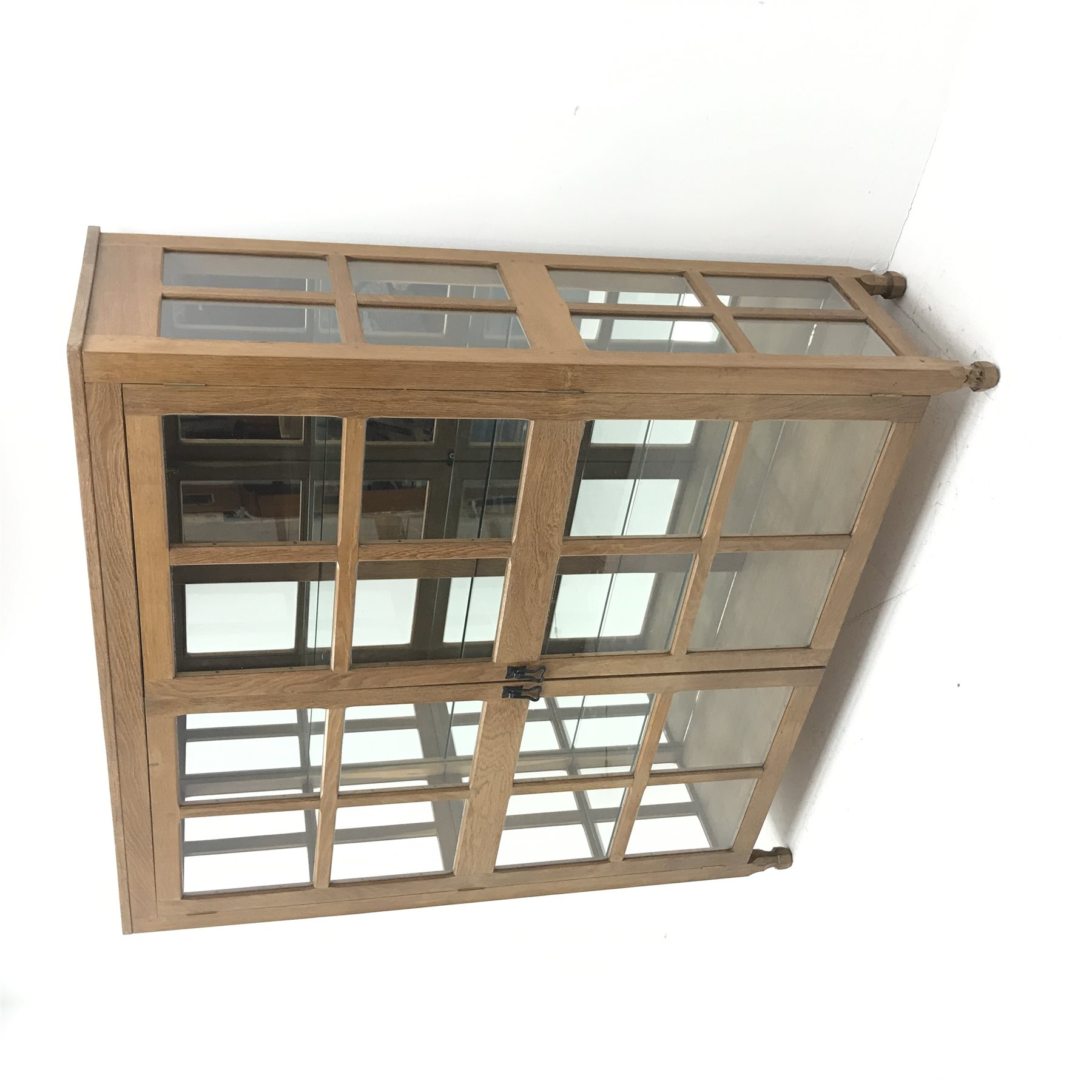'Foxman' large oak and glazed display cabinet, two doors enclosing three glass shelves and mirrored back, by Don Craven of Oldstead, Thirsk, W154cm, H169cm, D47cm
