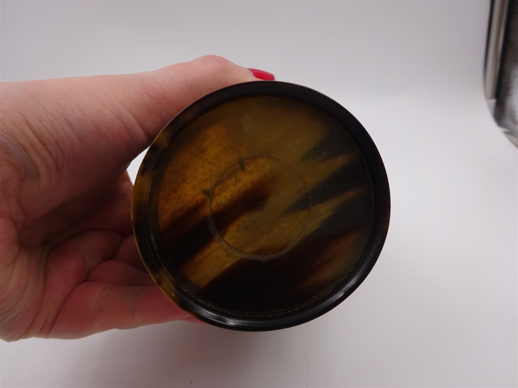 George III silver mounted horn cup, of tapering circular form, with polished exterior, the silver mounted collar hallmarked London 1808, no visible assay or makers mark, H13.5cm