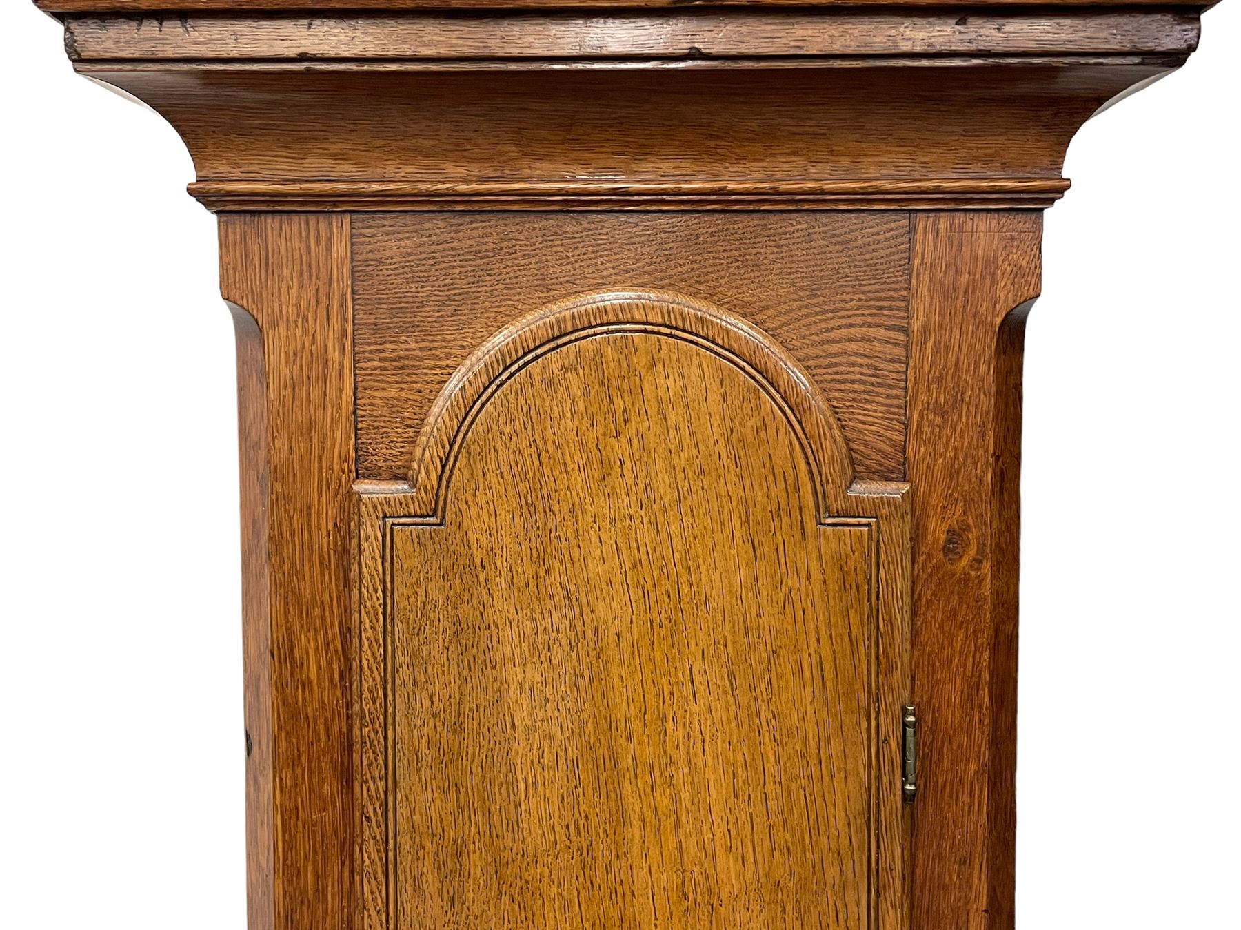 Henry Hindley of York – mid-18th century oak cased 8-day longcase clock,
flat topped caddy pediment with gesso finials, rectangular hood door flanked by wooden turned pilasters with capitals, canted trunk with a full-length break arch topped door on a short plinth with applied skirting and bracket feet, brass dial with a silvered chapter ring, Roman numerals and five-minute Arabic’s, minute and inner quarter hour tracks, matted dial centre with subsidiary seconds dial, blued steel hands and female head pattern spandrels, silvered calendar dial to the break arch with dolphin spandrels, four pillar rack striking movement, striking the hours on a bell. With weights and pendulum. 
H250 W48 D27
Henry Hindley originally from Wigan (Lancs) is recorded as working in York from Petergate 1731-41 then Stonegate 1741-1771. A famous and highly innovative maker, often referred to as the “Tompion of the North.” 
