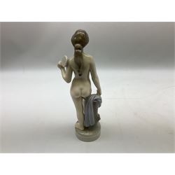 Royal Copenhagen 'Helena' figure modelled as a nude girl holding hand mirror, designed by Hans Hansen, model no. 4639, with printed and painted marks beneath, H25.5cm