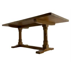 'Rabbitman' oak dining table, rectangular adzed top on twin octagonal pillar supports, sledge feet joined by floor stretcher, carved with rabbit signature, by Peter Heap of Wetwang