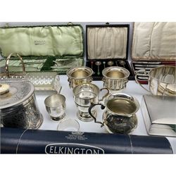 Group of metalware, largely comprising silver plate, to include oval caddy with chased decorated and ivory finial to the hinged cover, cigarette box with engine turned decoration, teapot, twin handled open sucrier, drinking glasses of various form, Elkinton Plate flatware in cylindrical boxes, various other cased and loose flatware.