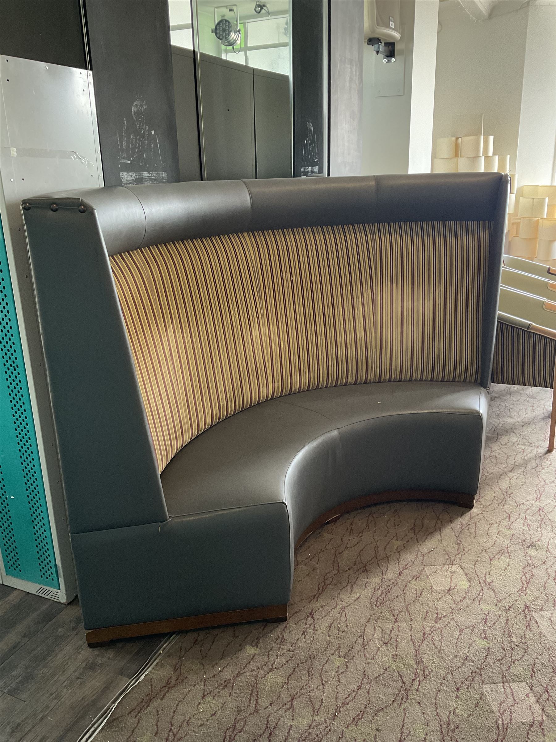 Curved restaurant bar seat, upholstered in grey leather and striped fabric- LOT SUBJECT TO VAT ON THE HAMMER PRICE - To be collected by appointment from The Ambassador Hotel, 36-38 Esplanade, Scarborough YO11 2AY. ALL GOODS MUST BE REMOVED BY WEDNESDAY 15TH JUNE.