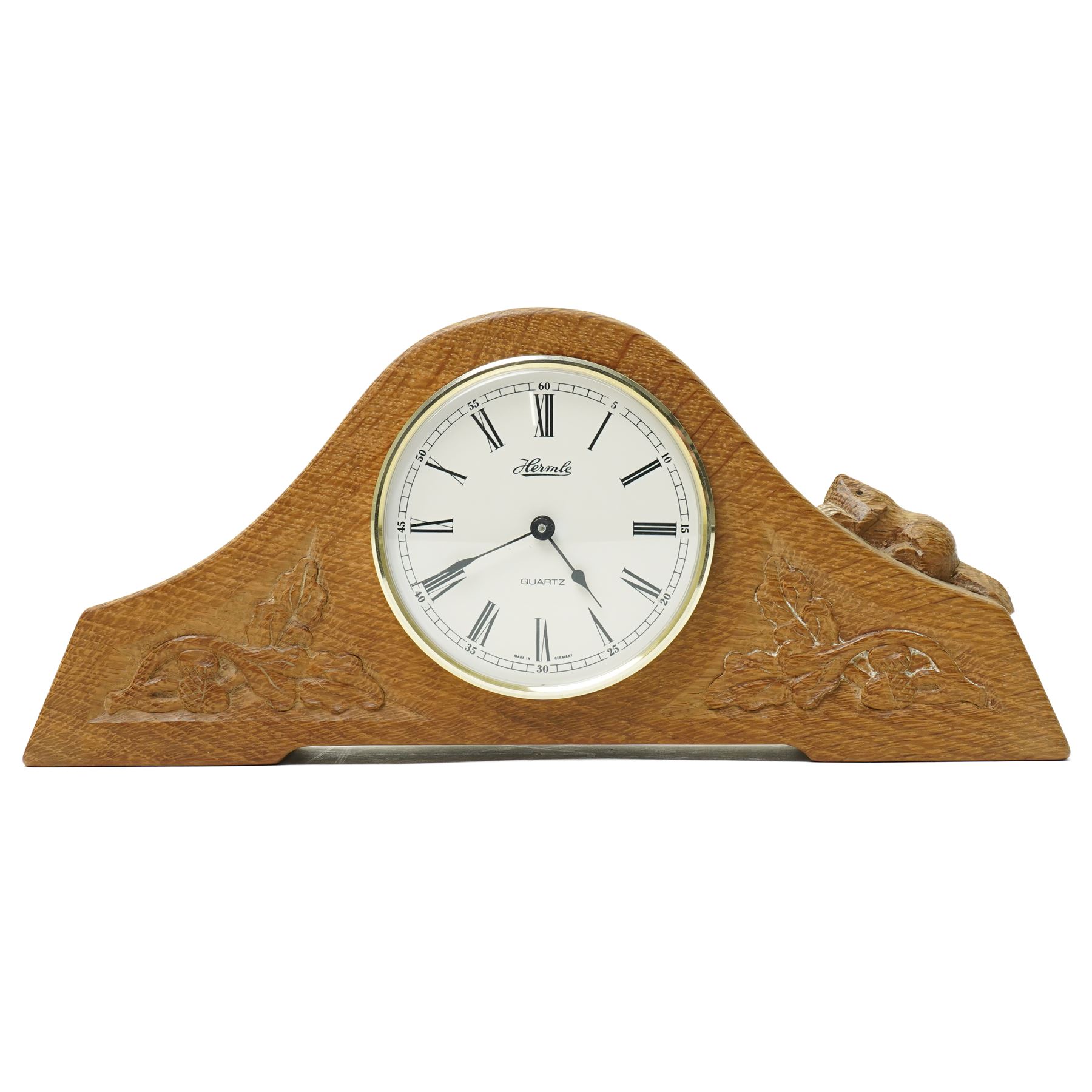 Beaverman - oak arched top mantel clock, with acorn and oak leaf carvings to spandrels, fitted with Hermle Quartz movement with Roman dial, with carved beaver signature, by Colin Almack of Sutton near Thirsk