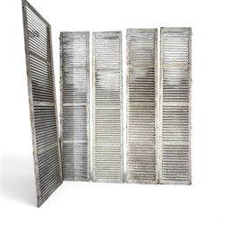 Five 19th century full height French Chateau louvre doors, pitch pine painted in cream finish, two having iron rod hinges, dimensions approx.