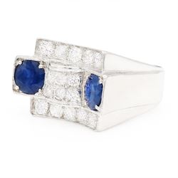 Platinum sapphire and diamond abstract design dress ring, pave set with eighteen old cut and round brilliant cut diamonds, with two mixed cut sapphires at each end, in a curved design setting, total sapphire weight approx 2.68 carat, total diamond weight approx 1.95 carat, with World Institute Report
