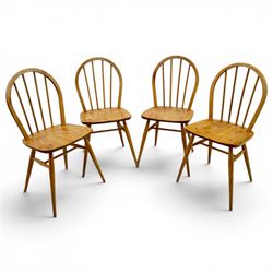 Ercol - set of four elm 'Windsor' chairs, hoop design back dish seat, tapering supports united by H-stretcher 