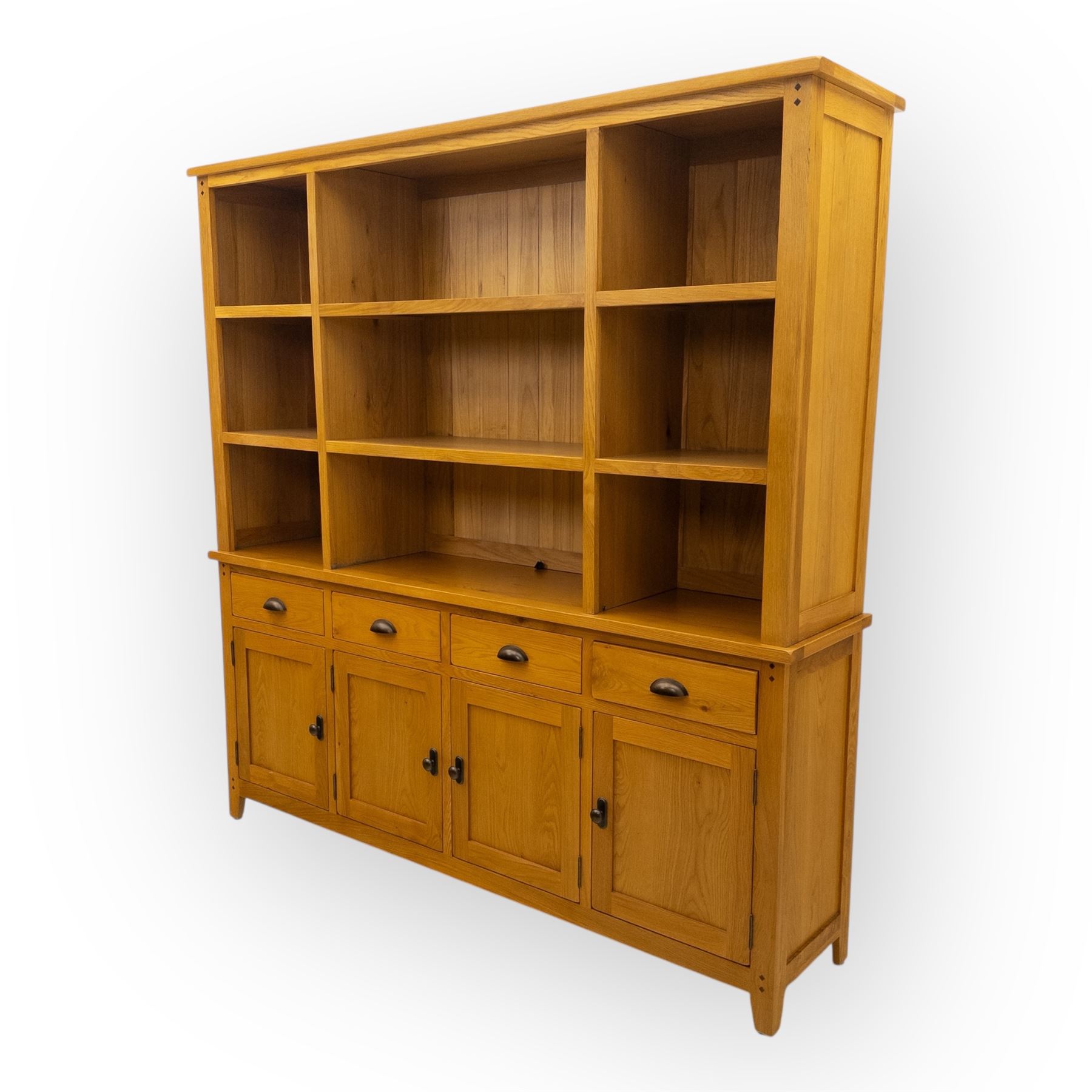Cotswold & Co - modern light oak dresser, the upper section with open shelving and divided compartments, the base fitted with four drawers over four panelled cupboard doors with metal handles