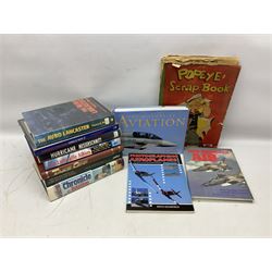 Ten books of predominantly military aircraft interest including Aircraft Anatomy World War Two, Hurricane Messerschmitt, The Avro Lancaster, The Luftwaffe Album, Encyclopaedia of Aircraft of WWII etc; together with a scrap album of WW2 newspaper cuttings