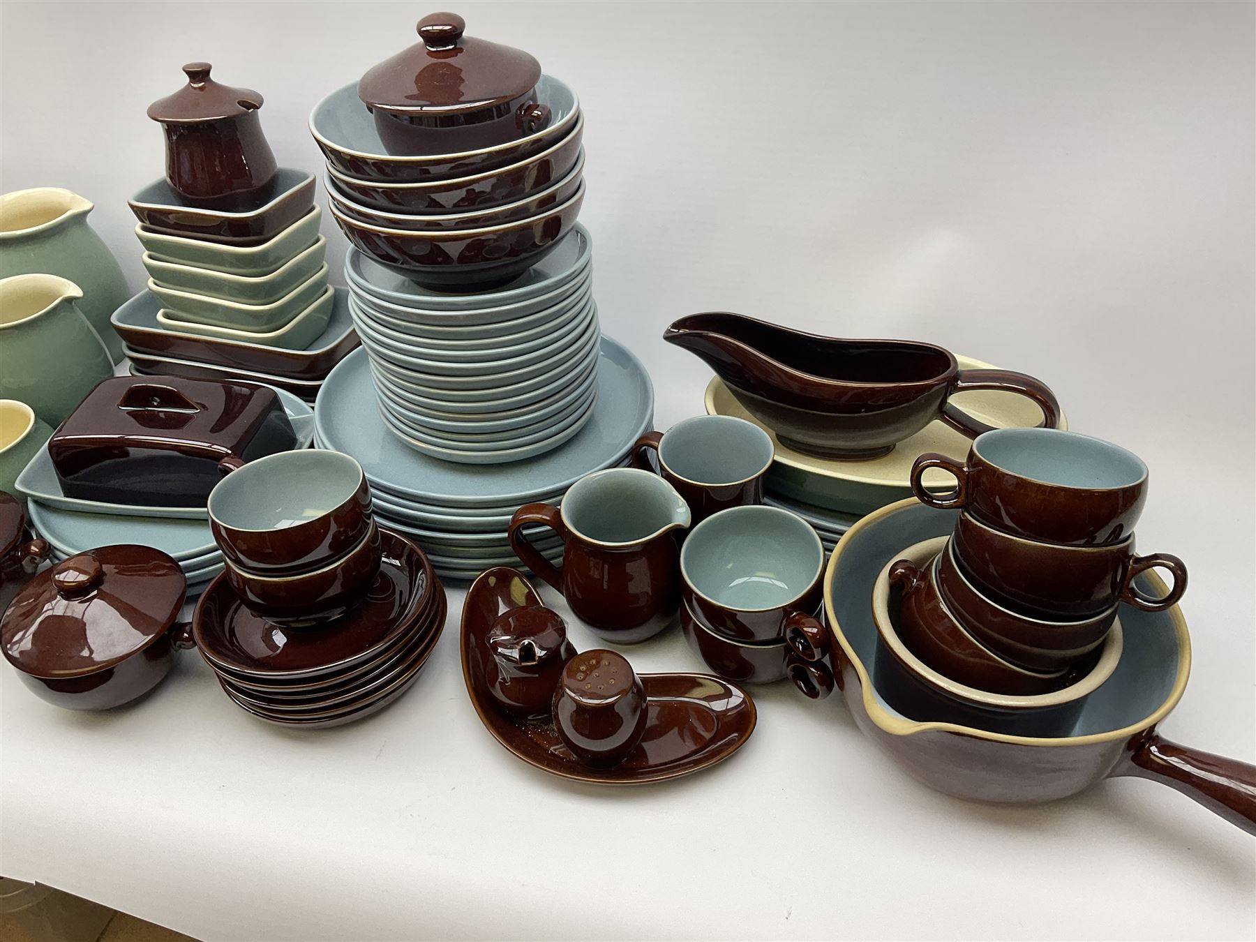 Denby dinner and tea wares, comprising largely Homestead pattern, to include dinner plates, salad plates, serving plates and dishes, bowls, teapot, coffee pot, hot water pot, teacups, saucers, milk jug, etc. 