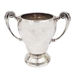 1920s silver trophy cup, of typical form, with twin C scroll handles, upon stepped circular base, hallmarked Birmingham 1926, maker's mark worn and indistinct, H14cm