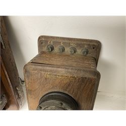 Two Hunningscone patent wall mounting telephones in walnut casing, together with Sterling Telephone & Electric Co. Ltd early wall-mounted telephone 'Primax' and one other 