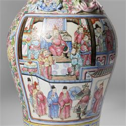 Large pair of 19th century Cantonese famille rose vases, each painted with various courtly scenes, including a display of warriors fighting on horseback before an official and his attendants, double Buddhist lion handles and applied at the shoulders with chilong, the lower band painted with Greek key motif, H58cm (2)