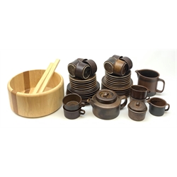 An Arabia Ruska Teaset designed by Ulla Procope, comprising tea pot, twelve tea cups, twelve saucers, twelve plates, milk jug, sucrier and cover, and large jug, together with a large Arabia salad bowl and servers. 