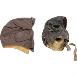WWII leather air force flying helmet, together with one other leather helmet