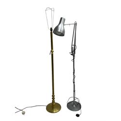 Adjustable metal standard lamp; and a burnished brass standard lamp (H133cm)