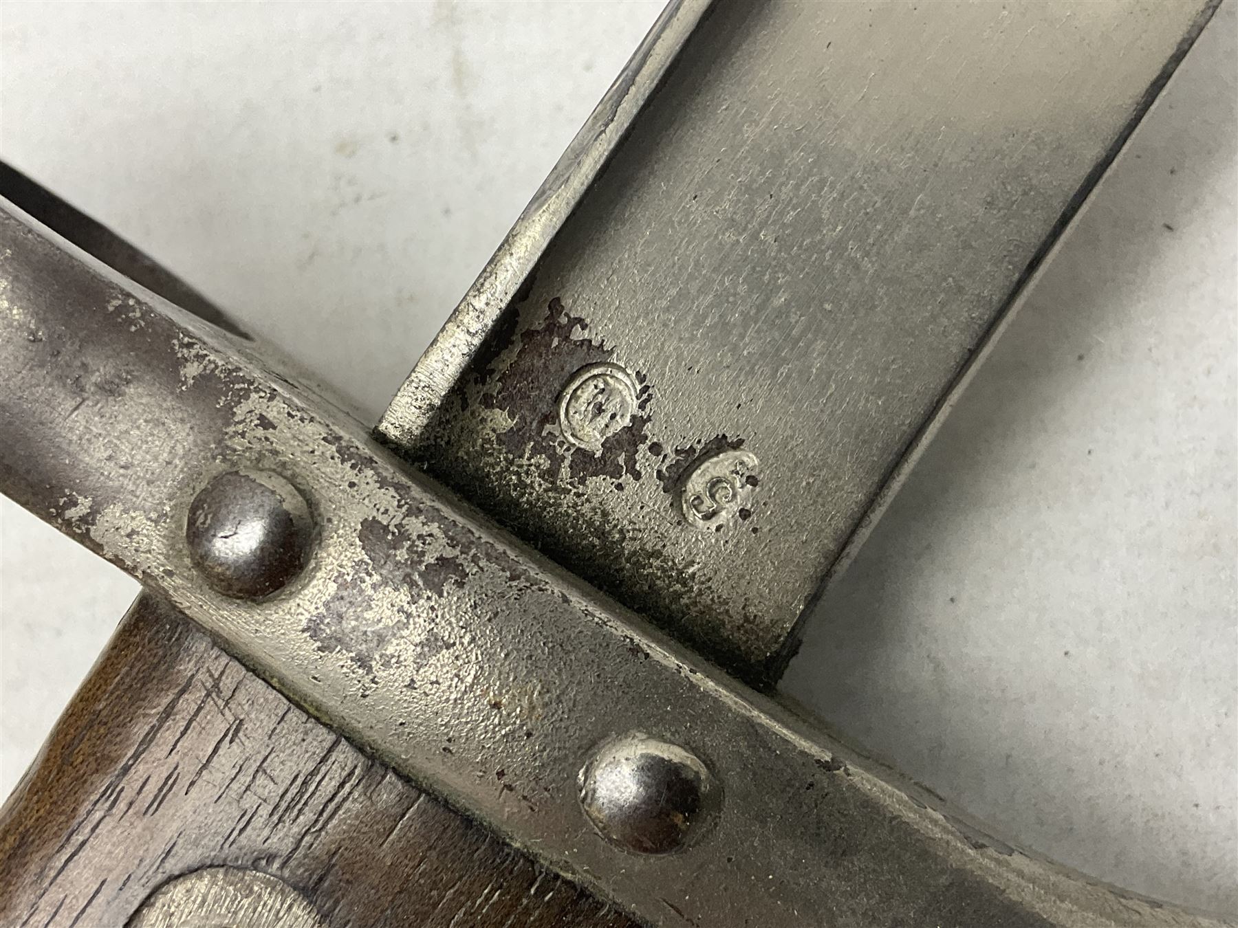 French Model 1866 Chassepot bayonet with 57cm curving fullered steel blade dated 1873 No.L63963; in steel scabbard with conforming number L71.5cm overall; and French St. Etienne Gras bayonet dated 1878 No.K10674 in steel scabbard numbered 79437 (2)