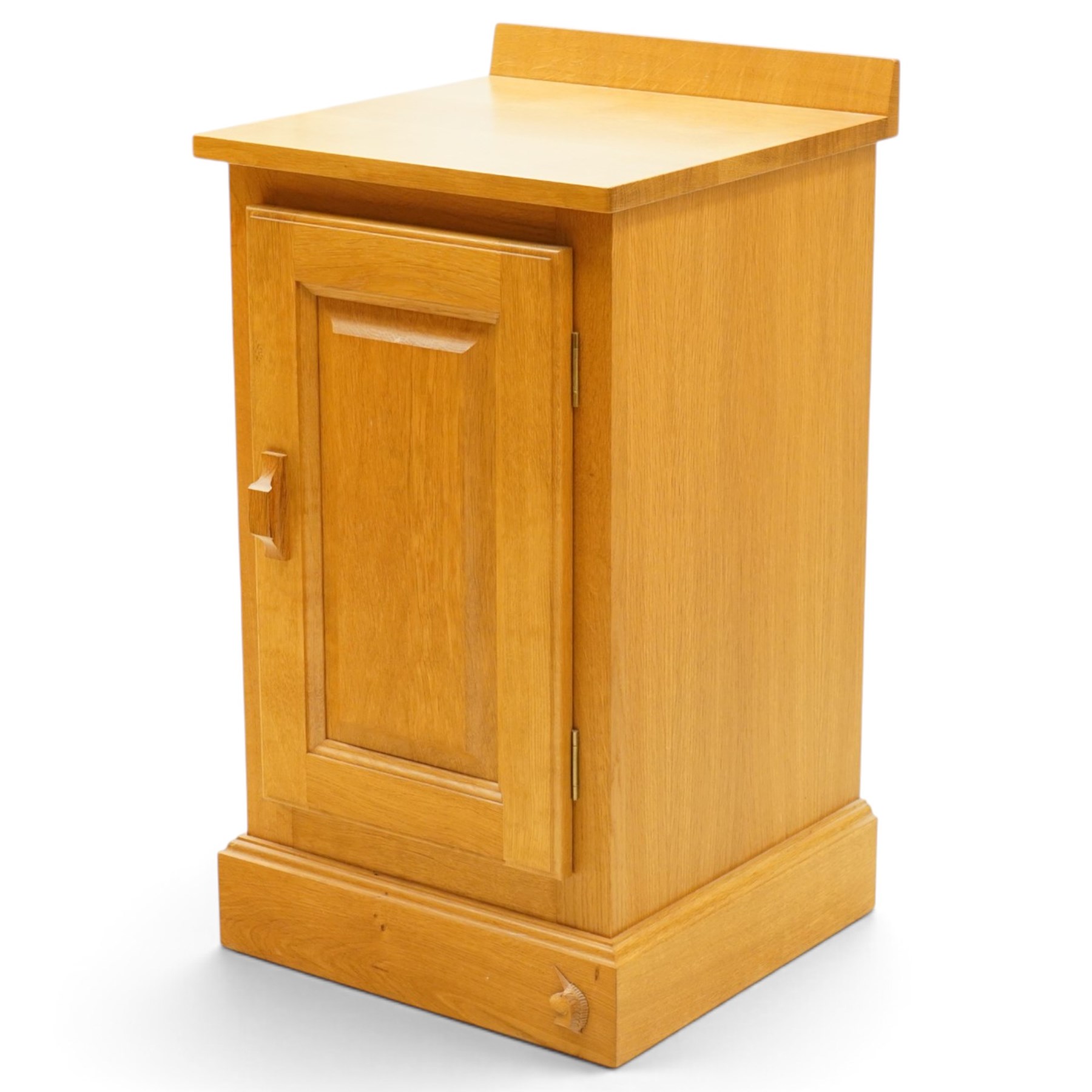 Unicornman - craftsman made oak bedside cupboard, raised back over panelled cupboard, on skirted base applied with carved unicorn signature, by Geoff Gell of Coxwold